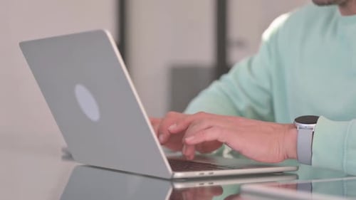 Close up of Man Typing on Laptop