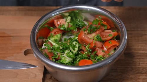 Preparing Delicious Tomato Cucumber Salad with Yogurt Dressing