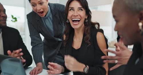 Cheerful Team Celebrating Success in the Office