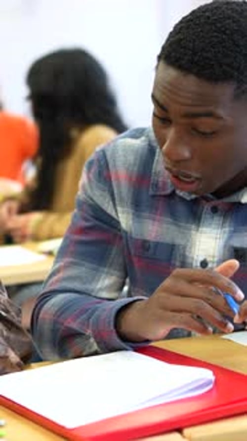 Students Collaborating and Studying in University Classroom