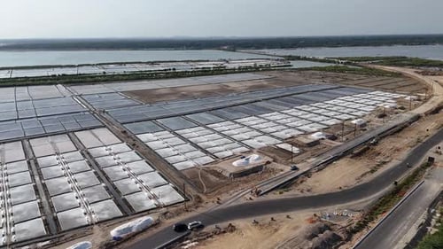 Vast Aerial View of a Salt Farm by Coast