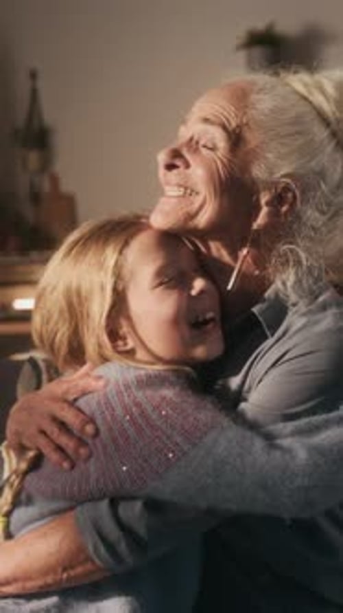 Grandmother and Child Embrace Affectionately Indoors
