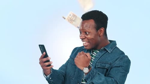 Man Cheering While Money Falls From the Sky