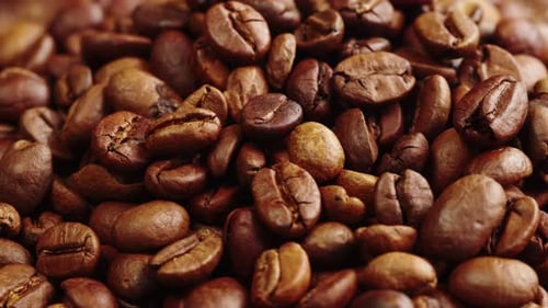 Roasting Coffee Beans with Smoke on Dark Background Close Up Arabica Robusta Colombian Beans