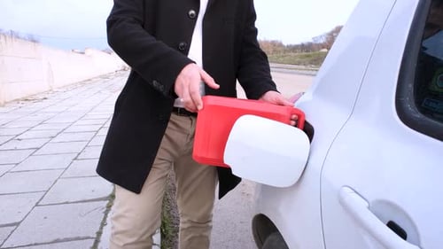 Man Refueling Car