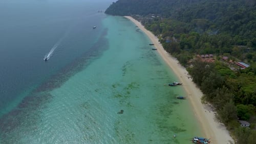 Explore the Beauty of Koh Kradan Island in Thailand with Pristine Beaches and Clear Waters
