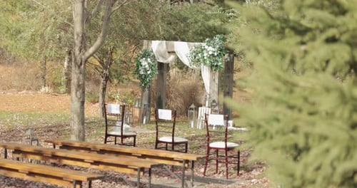 Beautiful rustic outdoor wedding ceremony venue during the fall season at Bean Town Ranch in Ottawa.