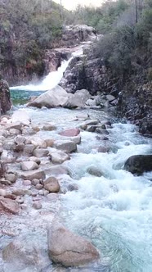 Vertical Video of Beautiful Mountain River with Cascades Flowing on Rocks