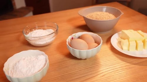 Baking Ingredients Laid Out on Wooden Table