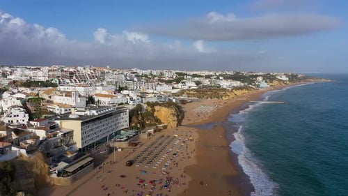 Aerial view of seaside Albufeira with wide beach and white architecture, Algarve, Portugal. Wide san