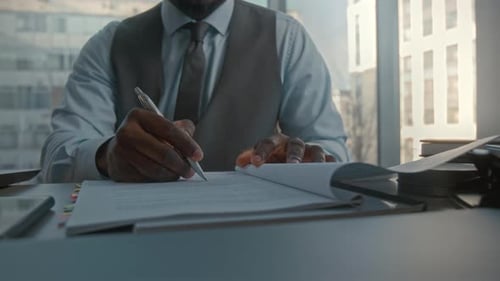 Businessman Signing Contract in Office