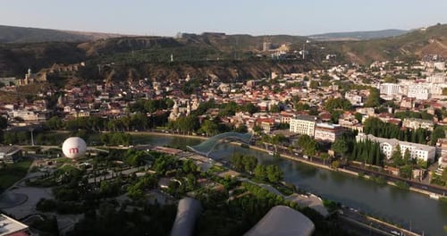 Amazing Aerial View of Rike Park, Kura River. Establishing Drone Shot. Tbilisi, Georgia