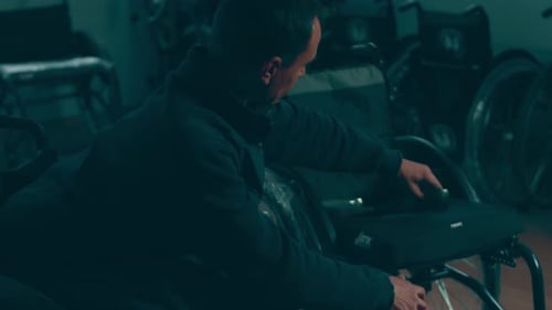 A Disabled Man Assembles a Stroller