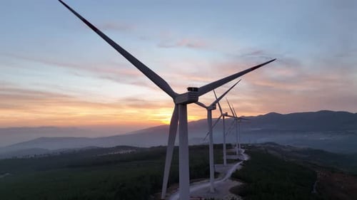 Aerial View Of Wind Turbines At Sunset