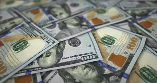 Dollar 100 banknote flying over money surface