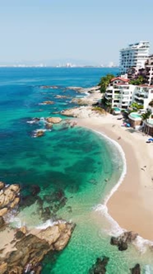 Majestic tropical beach in Puerto Vallarta Mexico with the city in the background