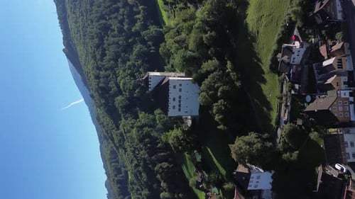 View of the Swiss city Werdenberg. Swiss Alps in the background. Roofs of houses