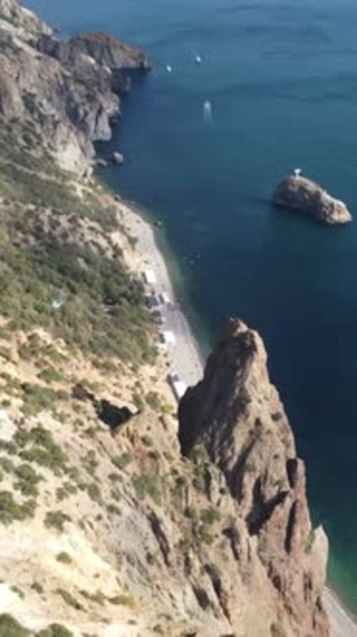 Aerial View on Calm Azure Sea and Volcanic Rocky Shores Small Waves on Water Surface Nature Summer