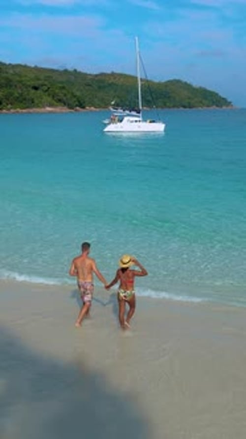 Couple in the Blue Ocean on the Beach of Anse Lazio Beach Praslin Island Seychelles
