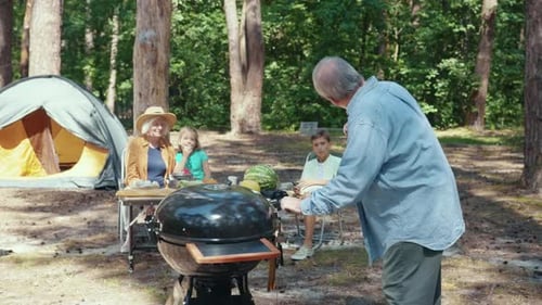 Family Enjoying a Camping Trip in the Woods