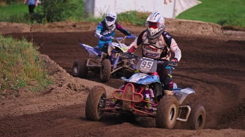 Quad Racing Competition - Racers on Dirt Muddy Passing Extreme Turn in Slow Motion