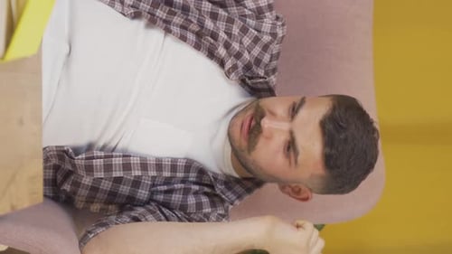Vertical video of The man who is angry with himself and has faults.