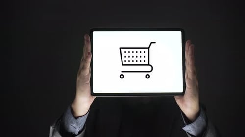 Tablet Displaying Shopping Cart in Dark Setting