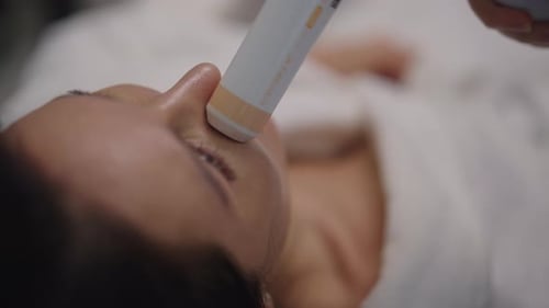 Woman Receiving Facial Treatment at a Medical Spa