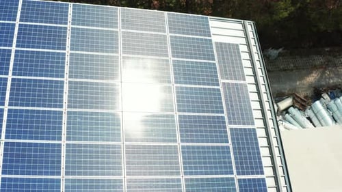 Blue Solar Panels on the Roof of an Industrial Building