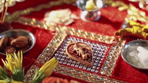 Diwali offering with nuts, crystals, and clay figure