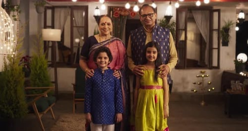 Portrait of Indian Family in Traditional Clothes Posing Together in Authentic Mumbai House. Senior