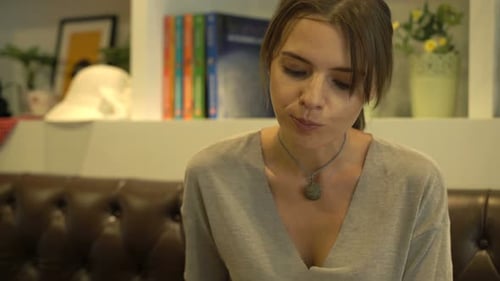 Young Woman Eating Fruit Salad Sitting in Cafe 30s