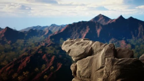 Rugged Rocky Ledge Overlooks a Breathtaking Mountain Range