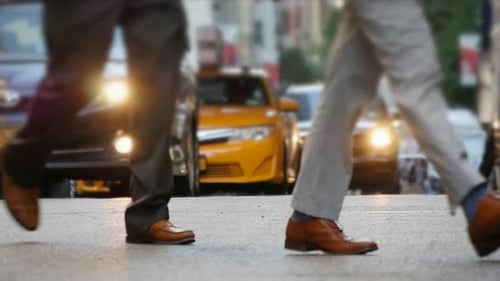 Business People Walking on Crowded City Street in Rush Hour Traffic