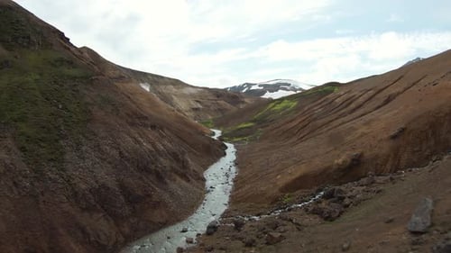 FPV drone soaring through moody canyon in Kerlingarfjöll, Iceland