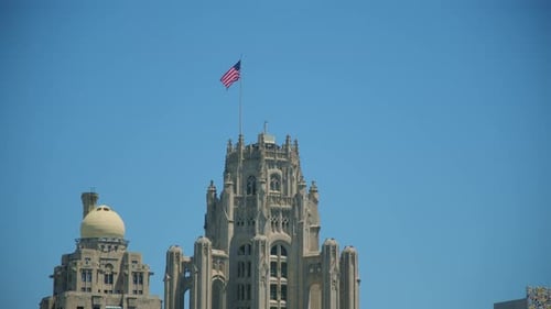 Gothic Building with American Flag on Sunny Day