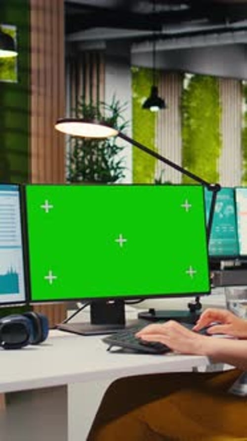 Vertical Video Executive Assistant Analyzing KPI Metrics on Computer Monitor with Mockup