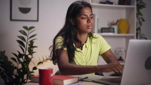 Young Indian Woman Using Laptop Home Office