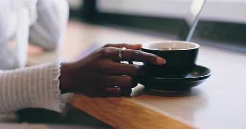 Coffee shop, relax and hands of woman by window with drink for calm, wellness and beverage in cafe