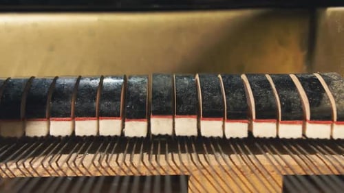 Piano Hammers Moving Inside Music Instrument