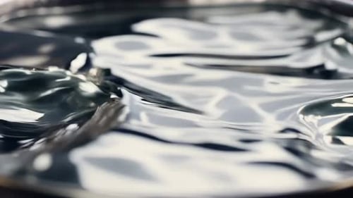 4K Dynamic Silver Liquid Motion Background - Abstract Metallic Flowing Waves