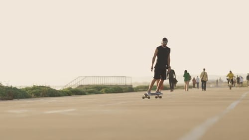 Adult Bearded Man Skating on Skateboard on the Street