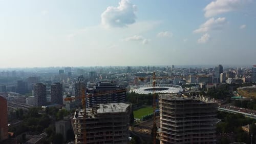 Modern Kyiv city center. Beautiful capital of Ukraine on a summer day. Olympic stadium in the backgr