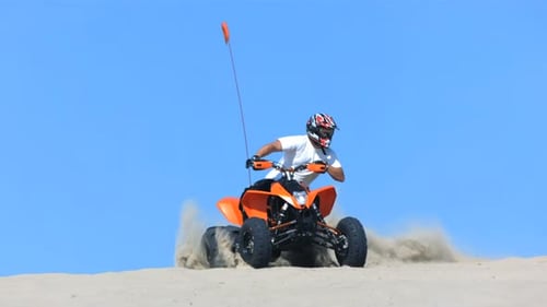 Quad Bike Sand Dune Pursuit in Slow Motion