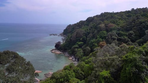 untoucht jungle at granite rocks island, turquoise water. Wonderful aerial view flight drone