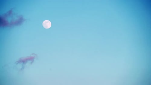 Full Moon in Blue Night Sky with Clouds