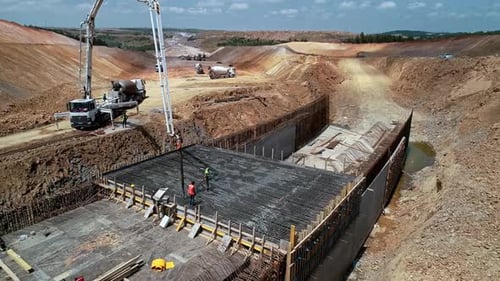 Concrete Pouring on Reinforced Slab at Highway Construction Site