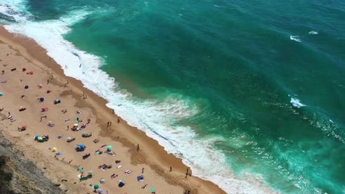 Aerial View of Sandy Beach and Turquoise Ocean
