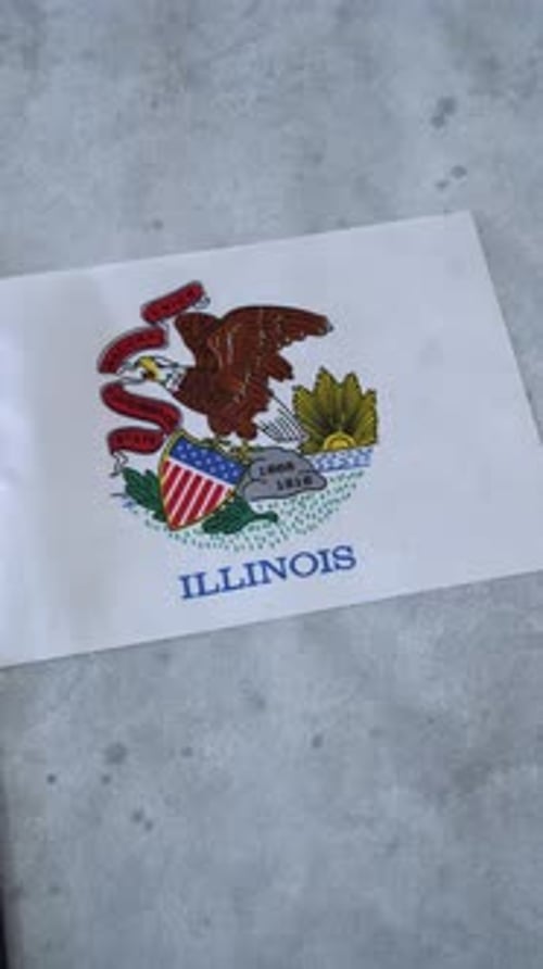 Illinois State Flag on Concrete Surface