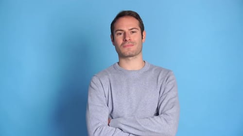 Confident Young Man with Crossed Arms